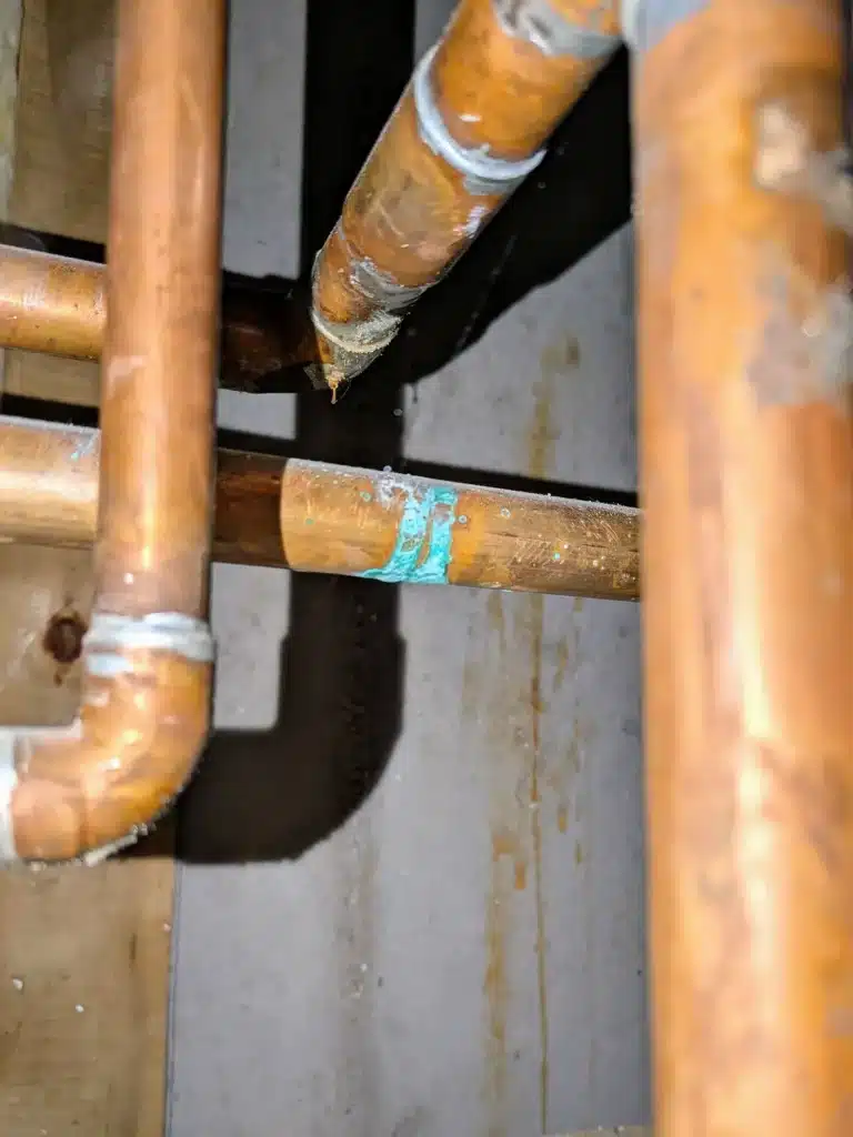 Copper supply pipe with a pinhole leak, cut out of an Atlanta home